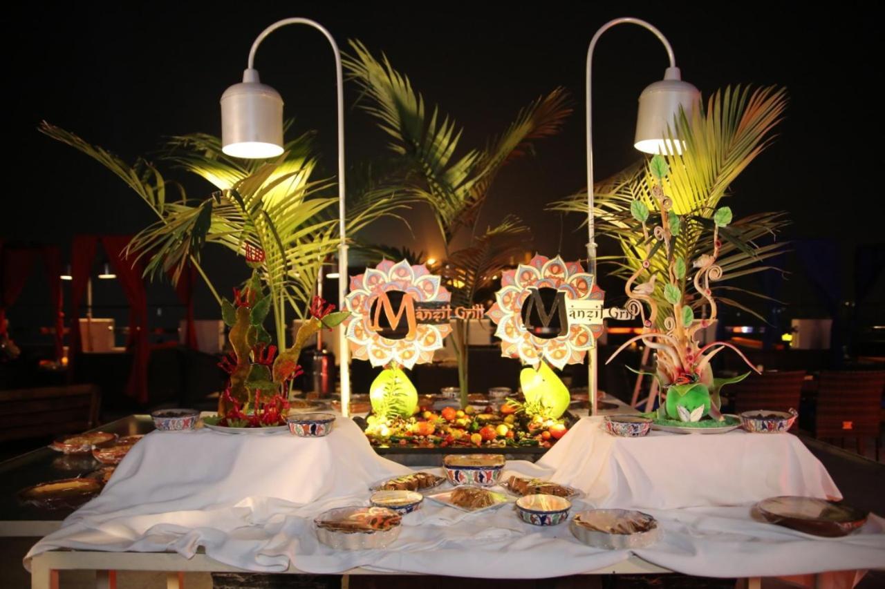 Park Lane Hotel Lahore Exterior photo A buffet at a resort