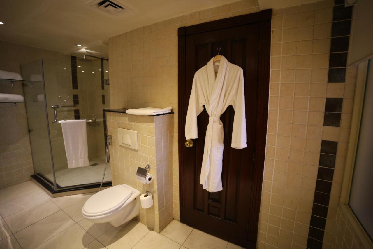 Park Lane Hotel Lahore Exterior photo A bathrobe hanging on a door