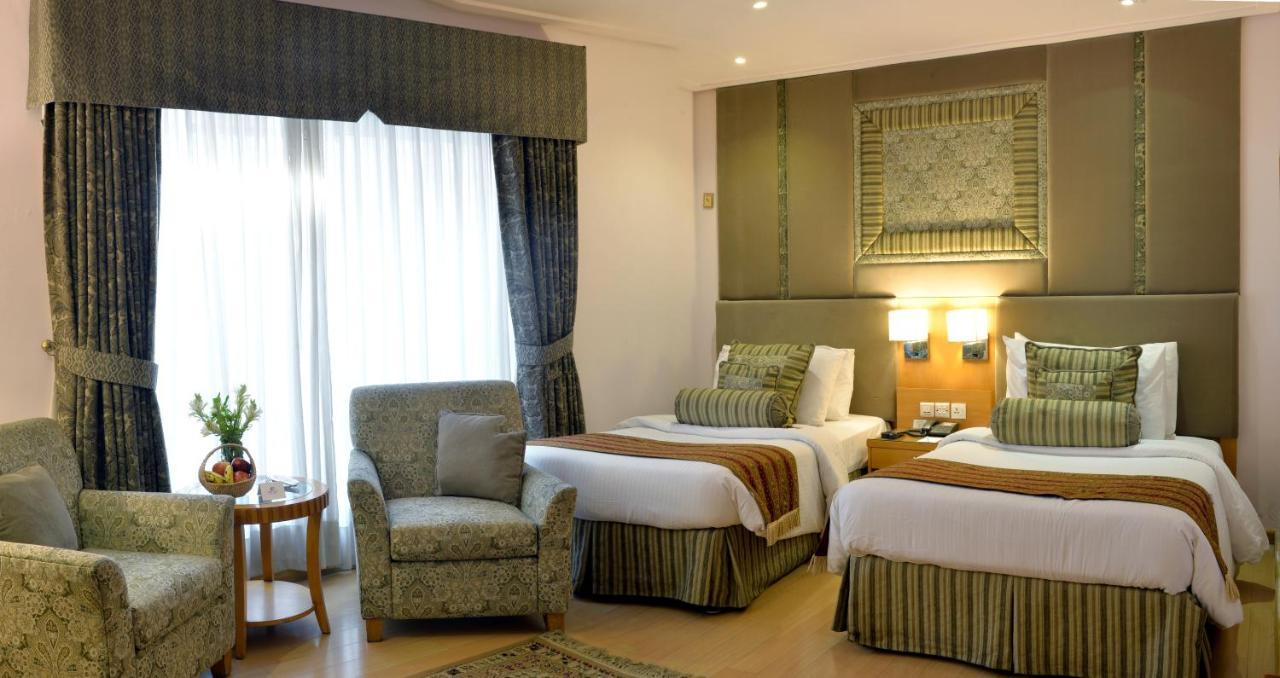 Park Lane Hotel Lahore Exterior photo A room at the hotel