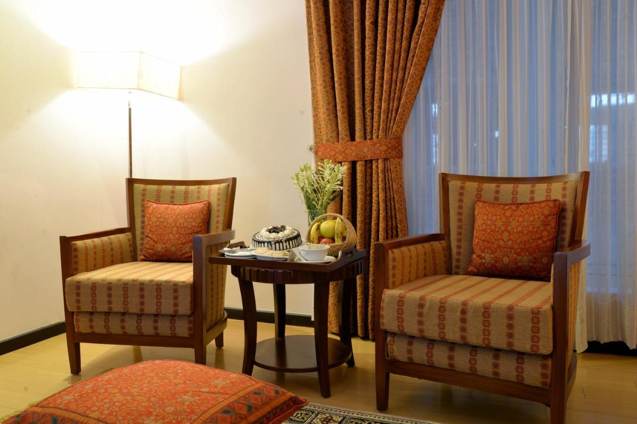 Park Lane Hotel Lahore Exterior photo A room at the hotel
